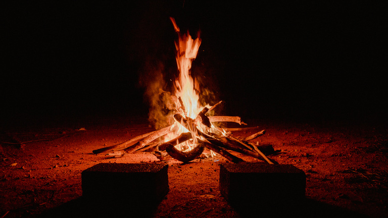 Crackling bonfire on a dark background, CC0, photo by Matheus Bertelli