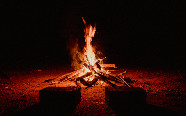 Crackling bonfire on a dark background, CC0, photo by Matheus Bertelli